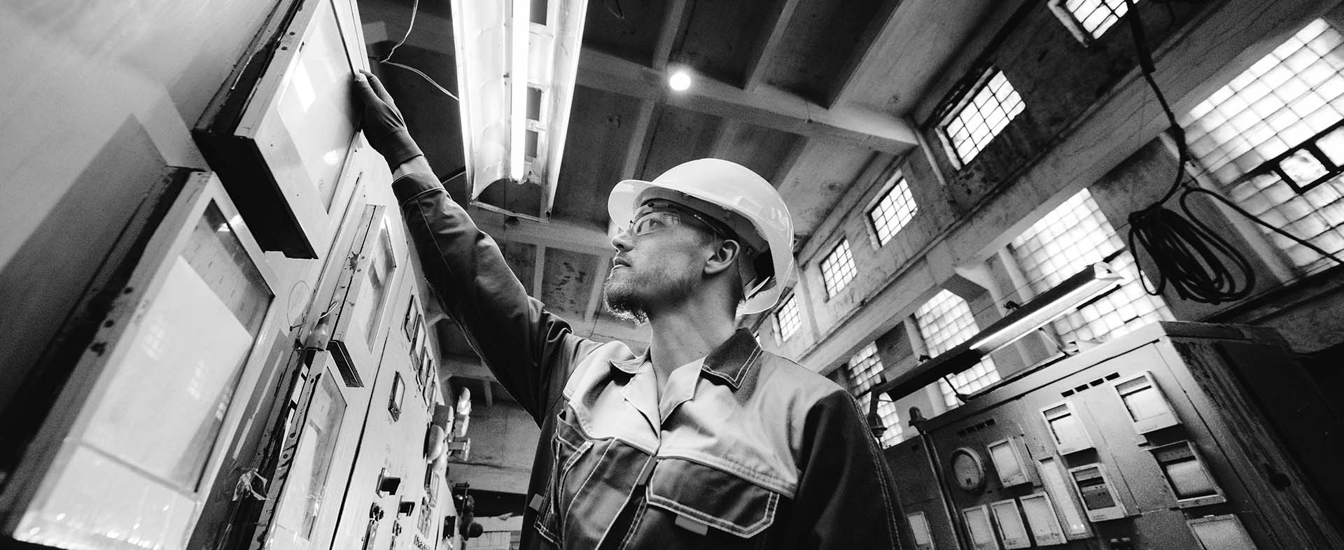a worker performing maintenance work industrial setting