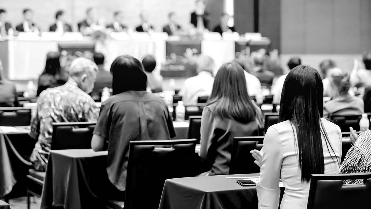 people in a seminar black and white