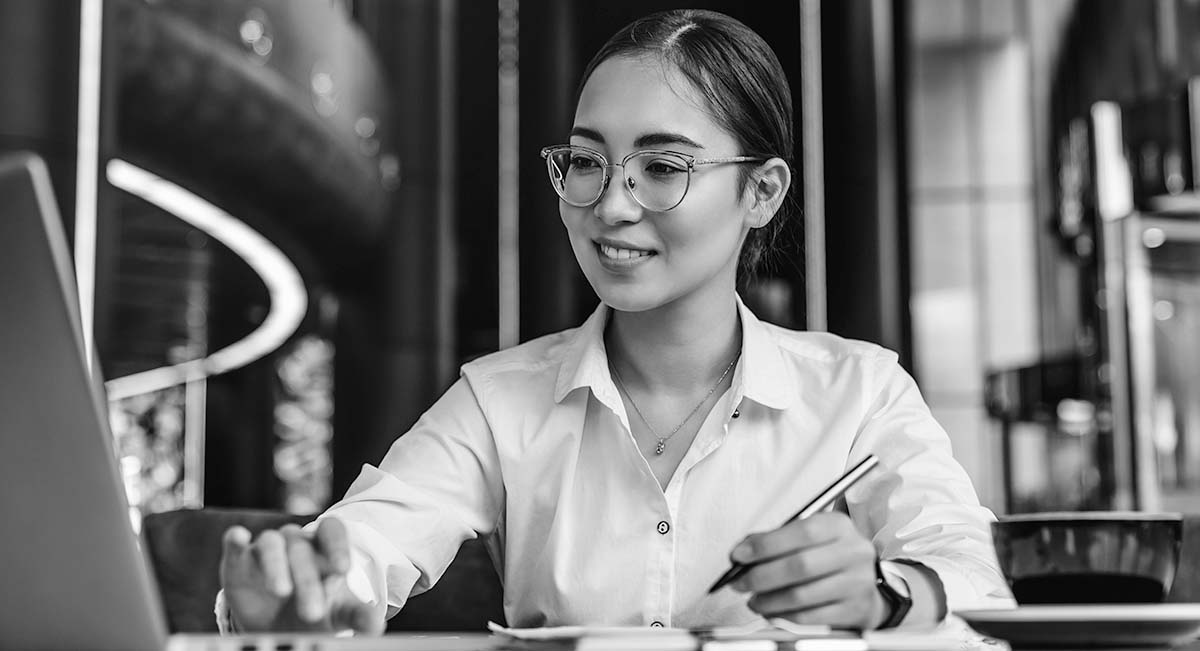 black and white picture of a woman typing