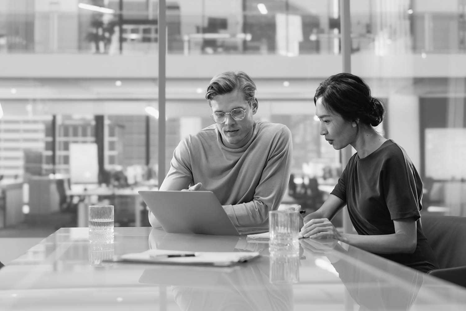 man and woman working in an office